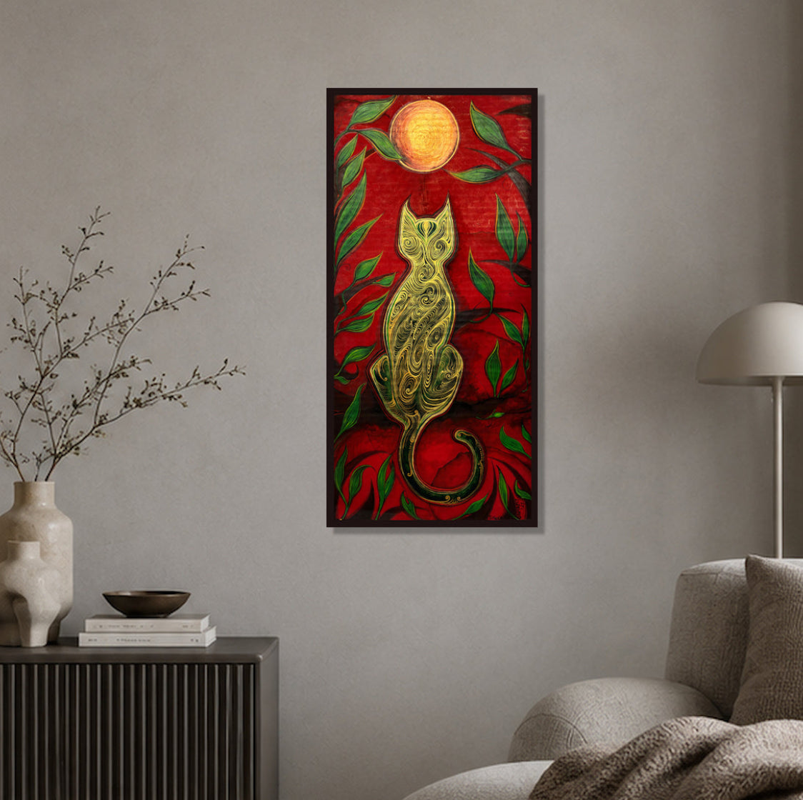 The Green Cat and the Golden Moon artwork by MatiArtBox displayed in a dark frame on a textured grey wall in a calm, modern minimalist living room.