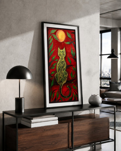 The Green Cat and the Golden Moon artwork by MatiArtBox displayed in a black frame above a wooden console in a modern industrial-style interior.